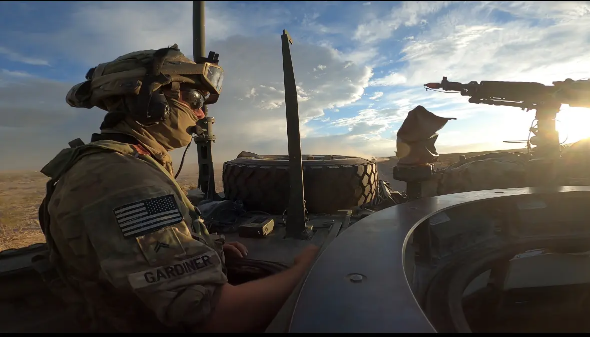 Service members operating equipment on a government contract